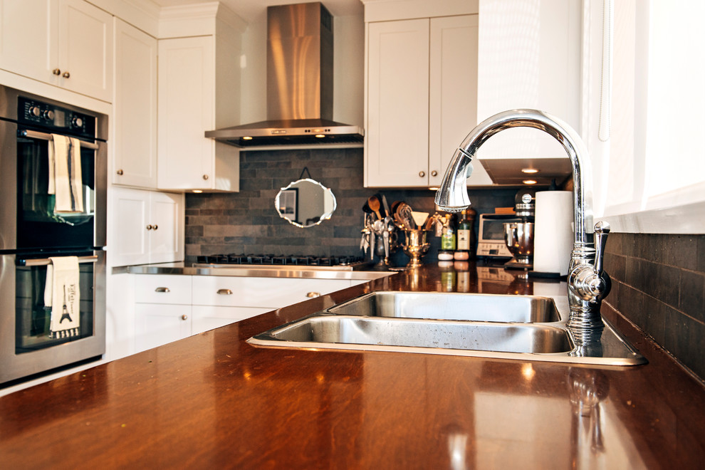 Example of a transitional kitchen design in Vancouver