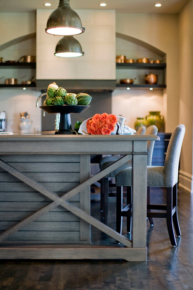 Example of a dark wood floor kitchen design in Calgary
