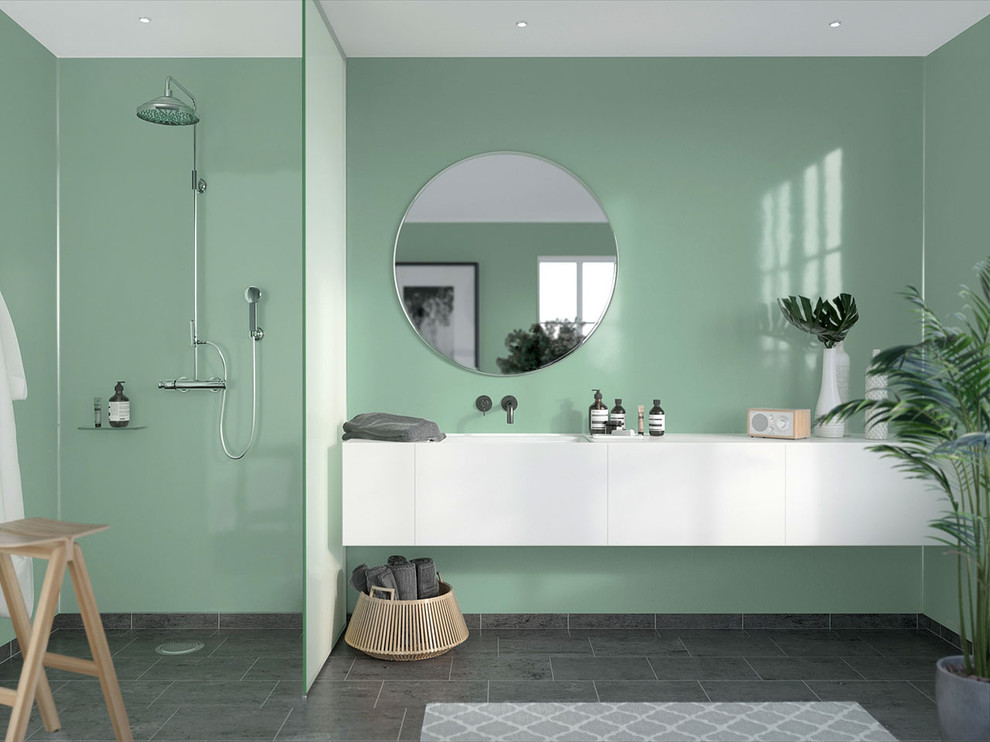 This is an example of a mid-sized modern master bathroom in Cleveland with flat-panel cabinets, white cabinets, an open shower, green tile, glass sheet wall, green walls and an open shower.