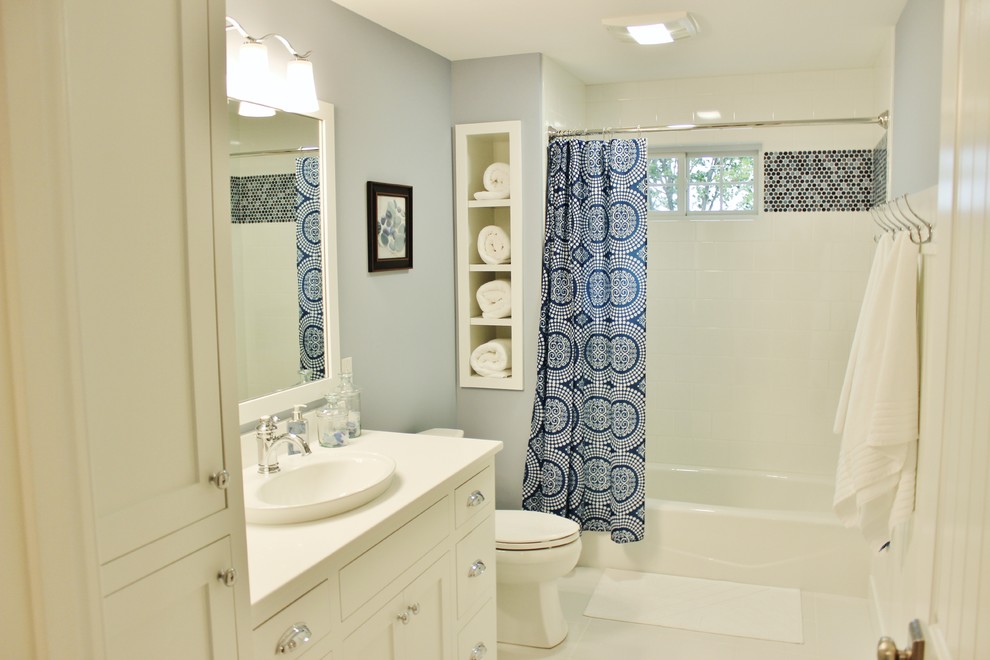 Inspiration for a beach style bathroom in Grand Rapids with a vessel sink, shaker cabinets, white cabinets, engineered quartz benchtops, white tile, ceramic tile, brown walls and ceramic floors.