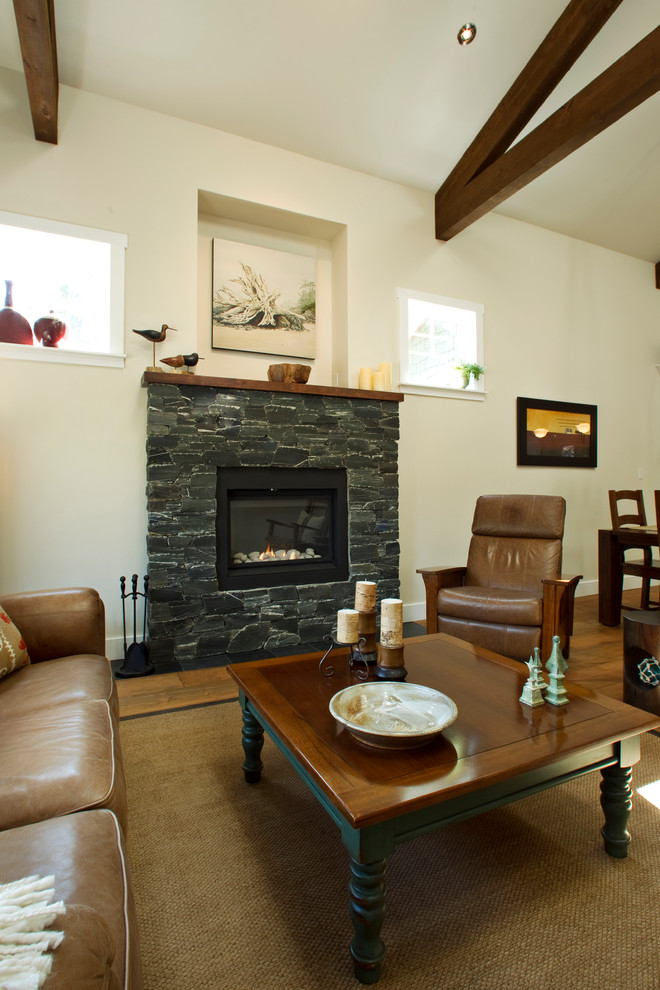 Inspiration for a transitional living room in Vancouver with a stone fireplace surround.