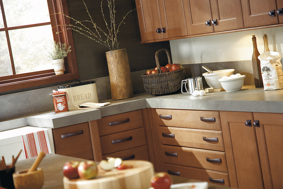 Example of a large mountain style eat-in kitchen design in Edmonton with a farmhouse sink, flat-panel cabinets and an island