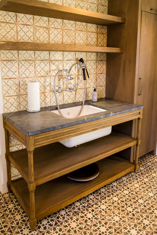 This is an example of a mediterranean laundry room in Santa Barbara.