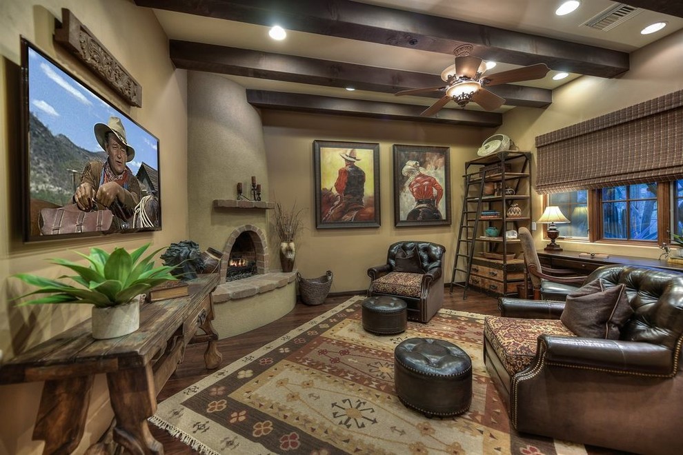 Large study room in Phoenix with beige walls, dark hardwood floors, a corner fireplace, a concrete fireplace surround and a freestanding desk.