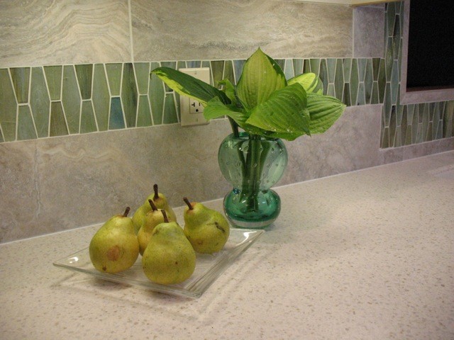 Example of a transitional kitchen design with green backsplash and mosaic tile backsplash