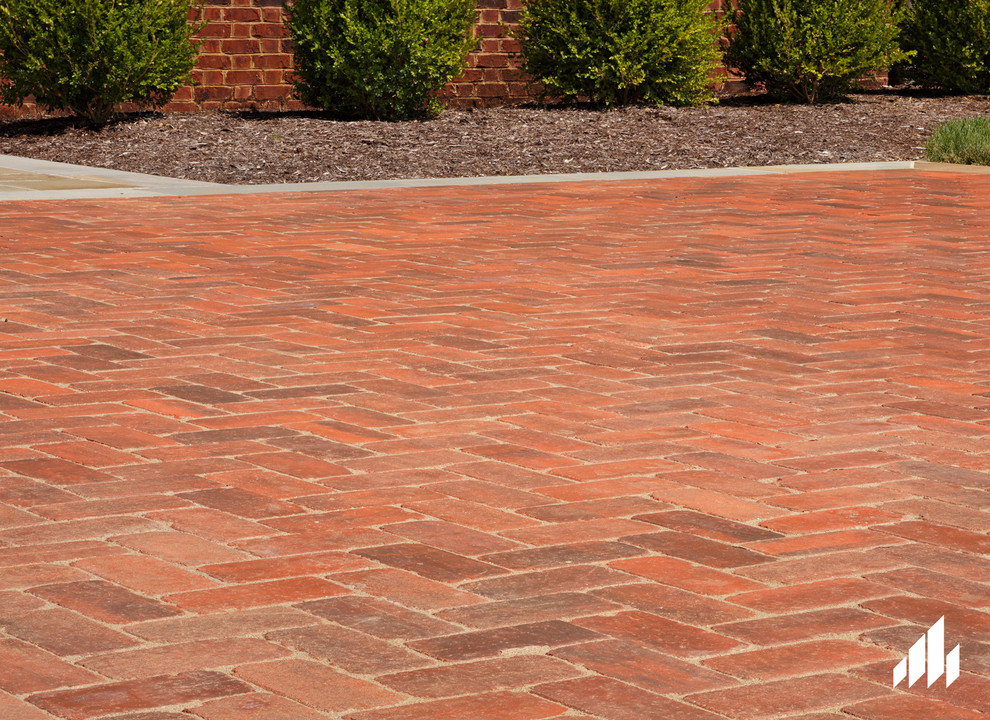 Contemporary patio in Other with brick pavers.