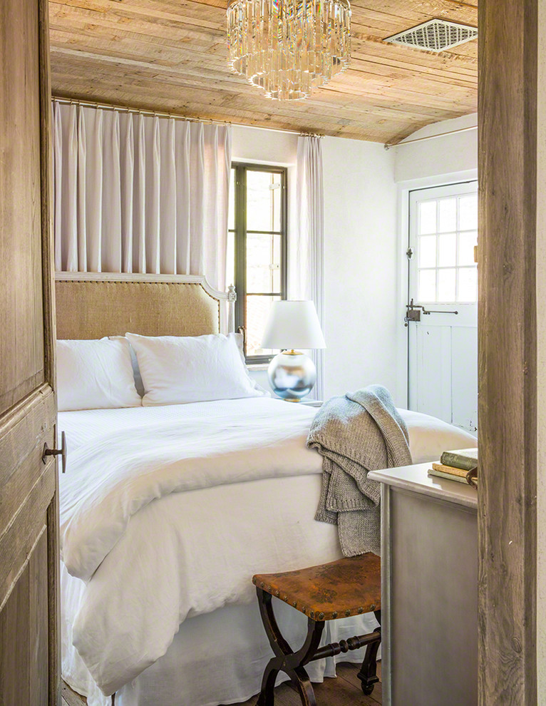 Example of a tuscan bedroom design in Phoenix