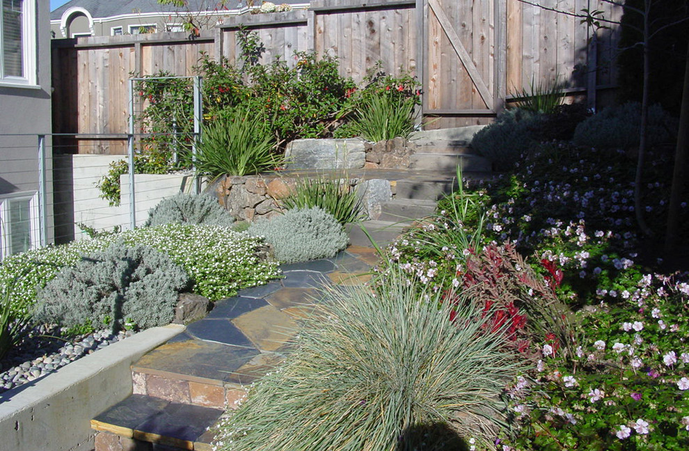 Design ideas for a small traditional backyard partial sun formal garden in San Francisco with a garden path and natural stone pavers.