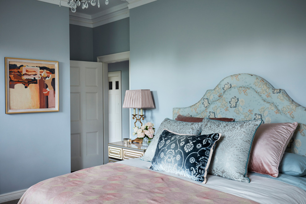 Inspiration for a large eclectic master bedroom in Sydney with blue walls, no fireplace, carpet and beige floor.