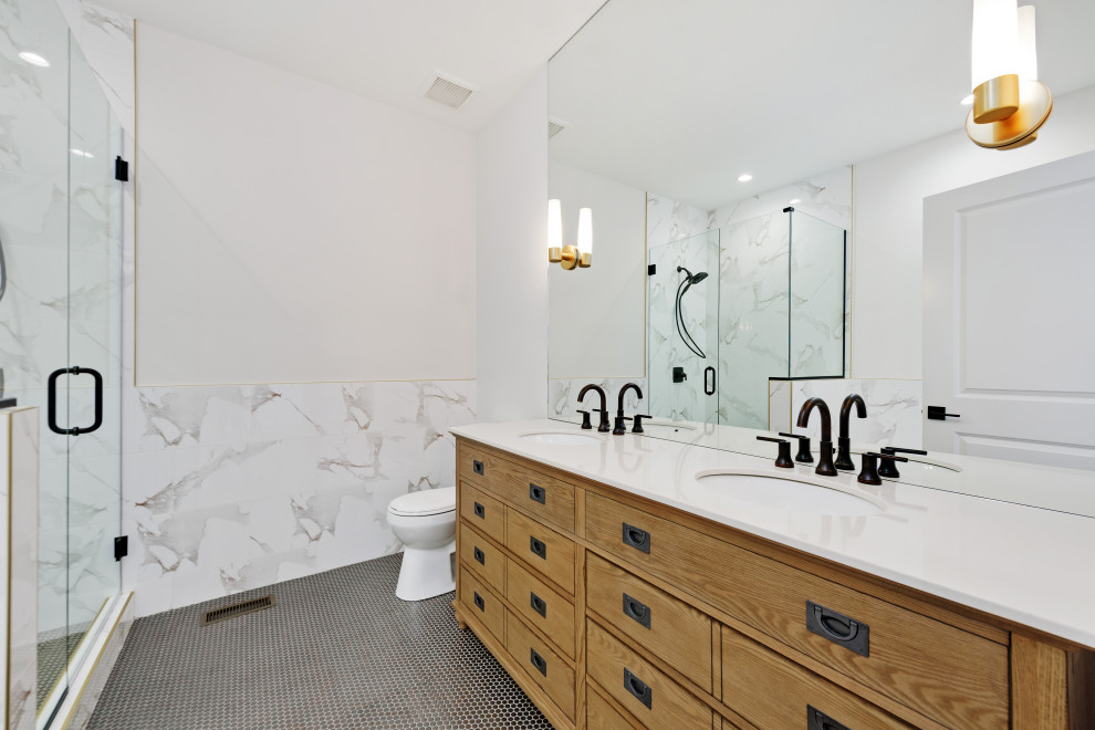 Transitional master mosaic tile floor and gray floor alcove shower photo in Chicago with flat-panel cabinets, medium tone wood cabinets, white walls, a wall-mount sink, a hinged shower door and white countertops
