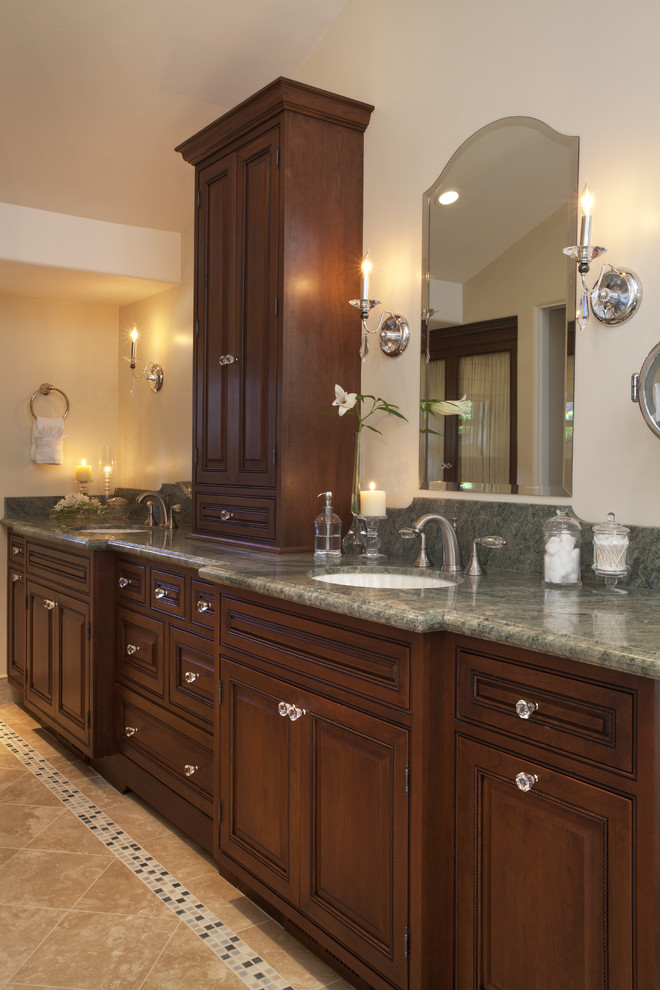 Large traditional master bathroom in San Francisco with raised-panel cabinets, dark wood cabinets, an undermount tub, a corner shower, multi-coloured tile, mosaic tile, beige walls, porcelain floors, an undermount sink, granite benchtops and green benchtops.