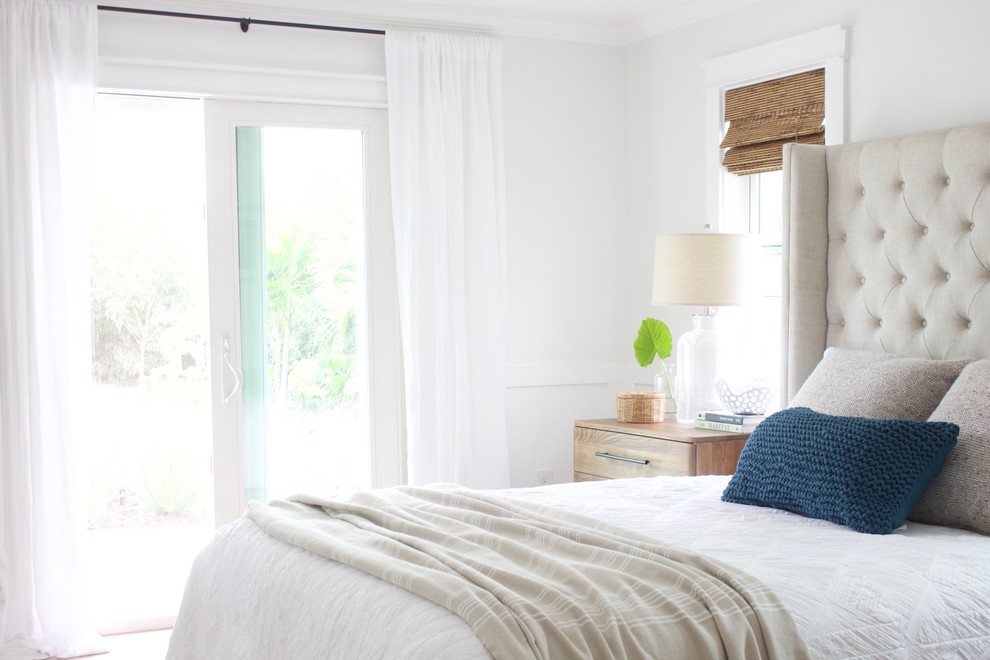 Small coastal master bedroom in Orlando with grey walls, ceramic flooring and beige floors.