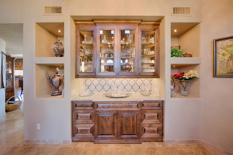Example of a mid-sized transitional travertine floor and beige floor home design design in Phoenix with beige walls
