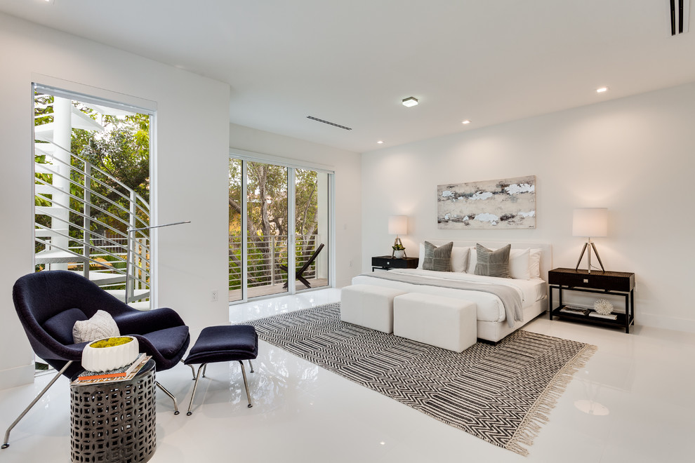 Photo of a large contemporary master bedroom in Miami with white walls, white floor, ceramic floors and no fireplace.