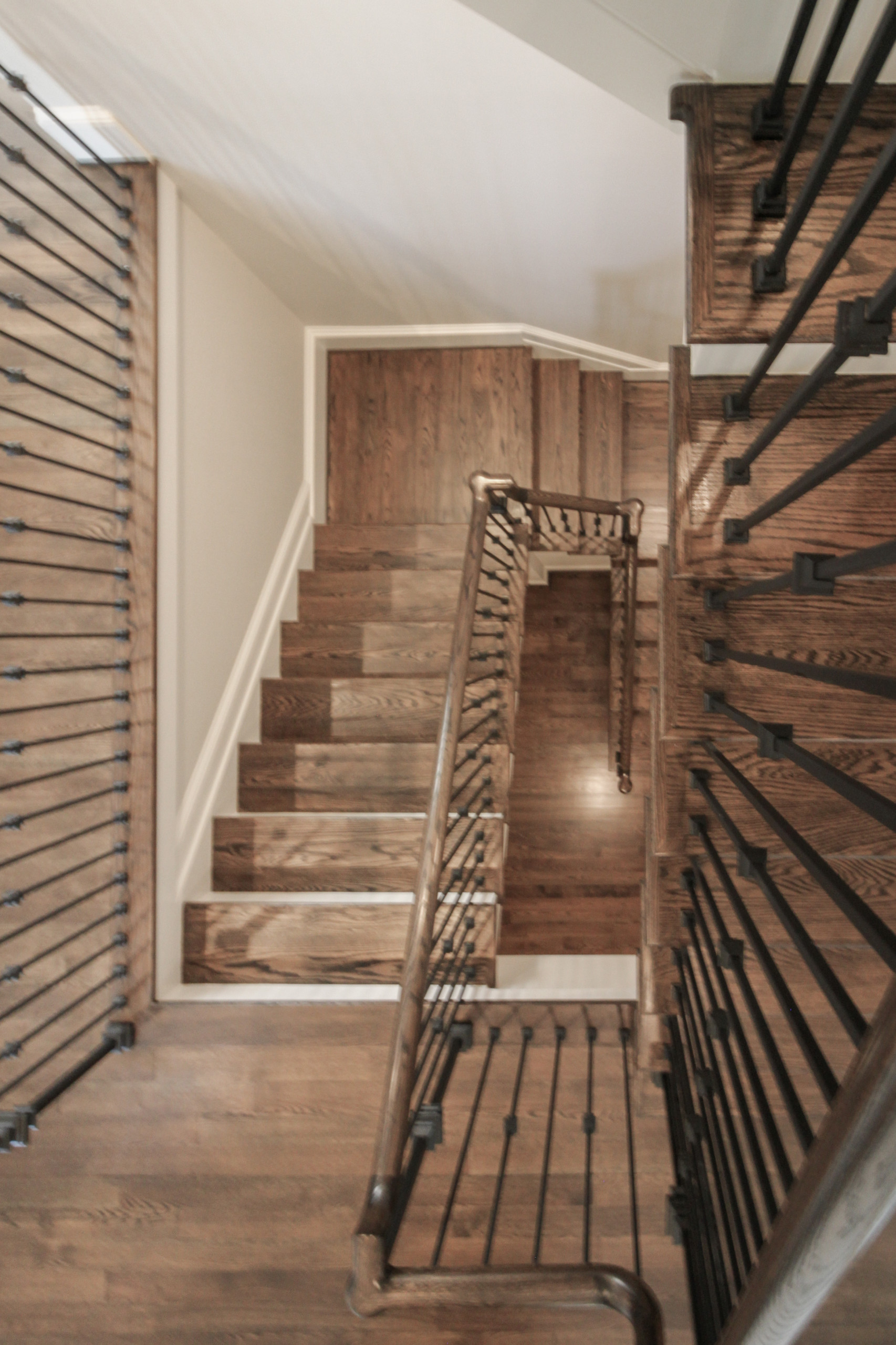 Project #86 | Sweeping Curved Staircase with Iron Balusters