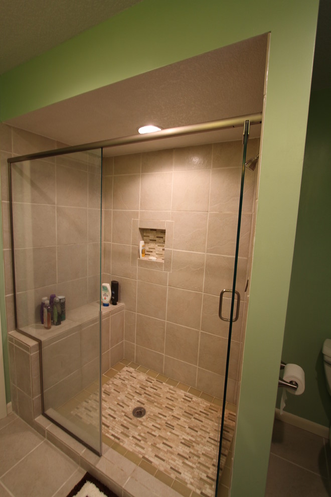 Contemporary master bathroom in Other with an alcove shower, gray tile, ceramic tile, green walls and ceramic floors.