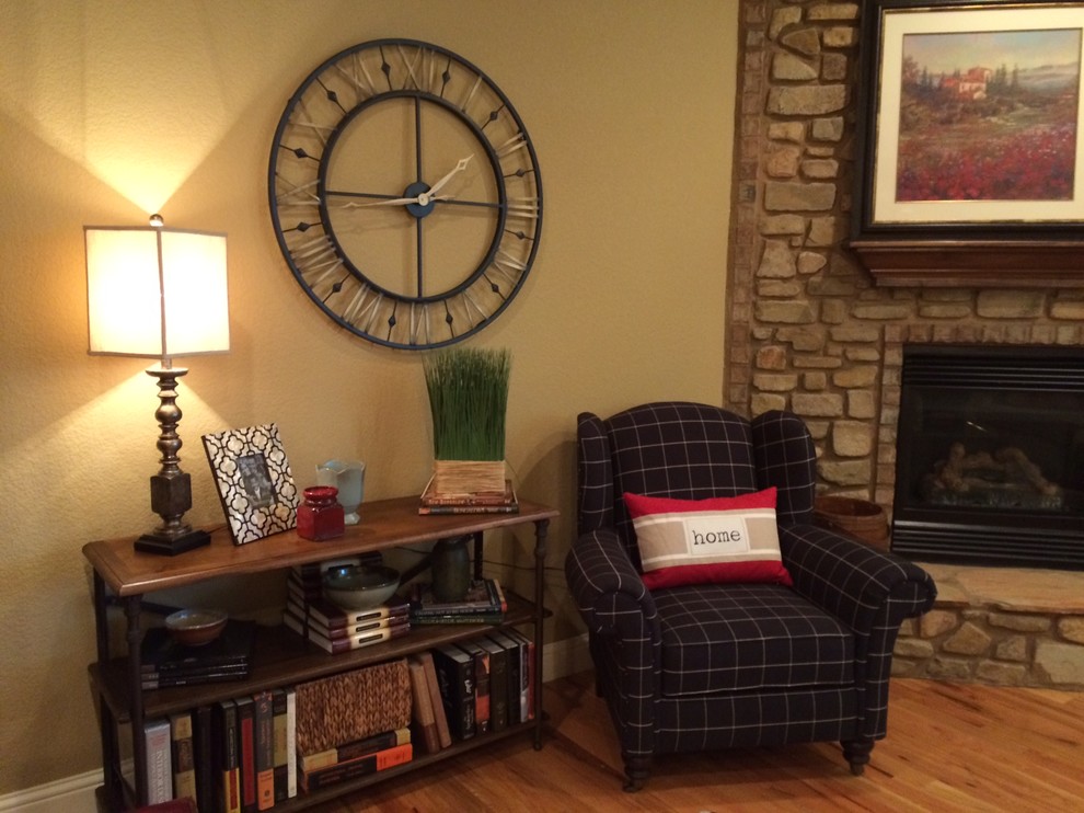 Mid-sized transitional open concept light wood floor living room photo with brown walls, a corner fireplace and a stone fireplace