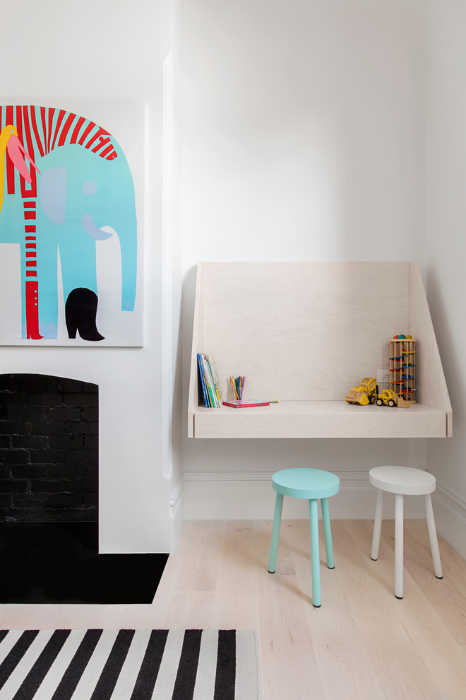 This is an example of a scandinavian kids' room for kids 4-10 years old in Melbourne with light hardwood floors.
