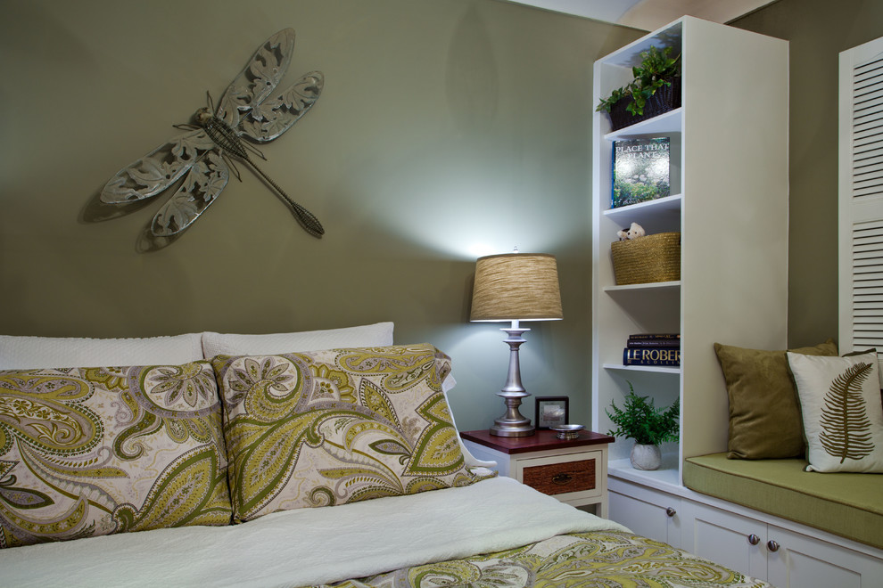 Design ideas for a mid-sized transitional guest bedroom in Ottawa with green walls and medium hardwood floors.