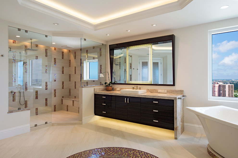 Design ideas for a large contemporary master bathroom in Miami with flat-panel cabinets, dark wood cabinets, a freestanding tub, a double shower, beige tile, white walls and a drop-in sink.