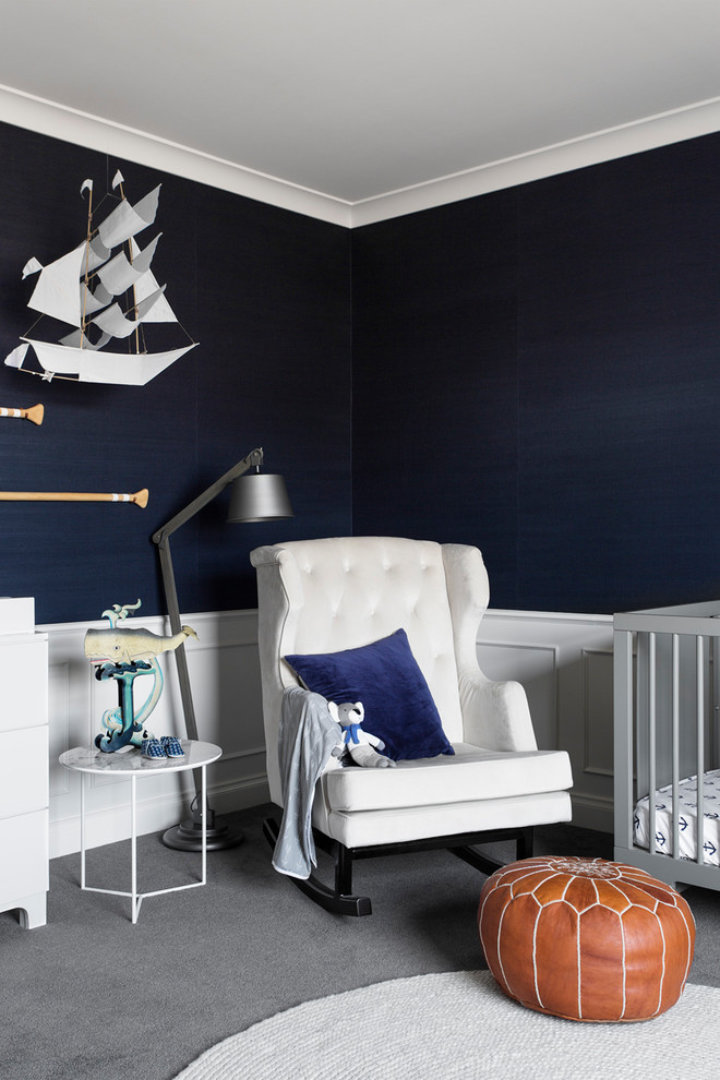 Beach style nursery in Melbourne with blue walls, carpet and grey floor for boys.