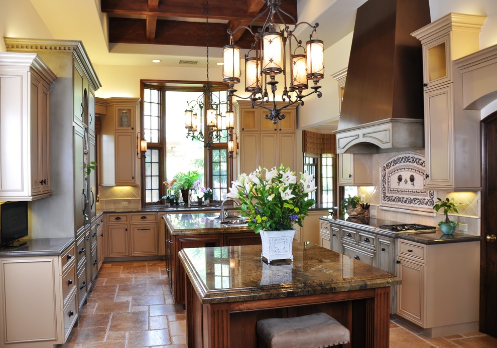 Photo of a traditional kitchen in San Diego with granite benchtops and multiple islands.