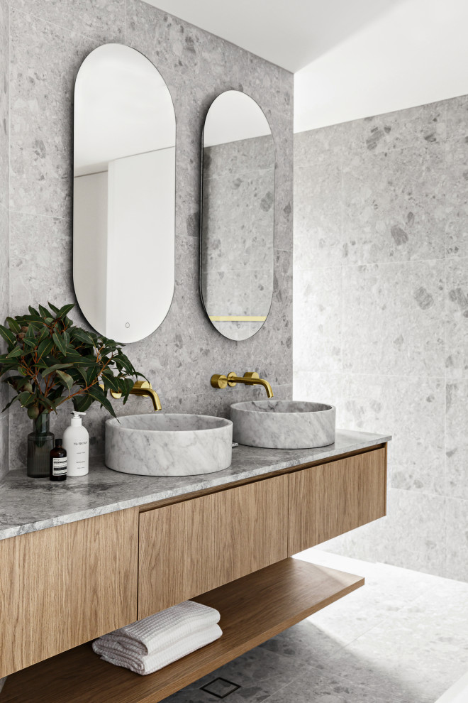 This is an example of a large mediterranean family bathroom in Sydney with a walk-in shower, ceramic flooring, marble worktops, an open shower, grey worktops, double sinks and a floating vanity unit.