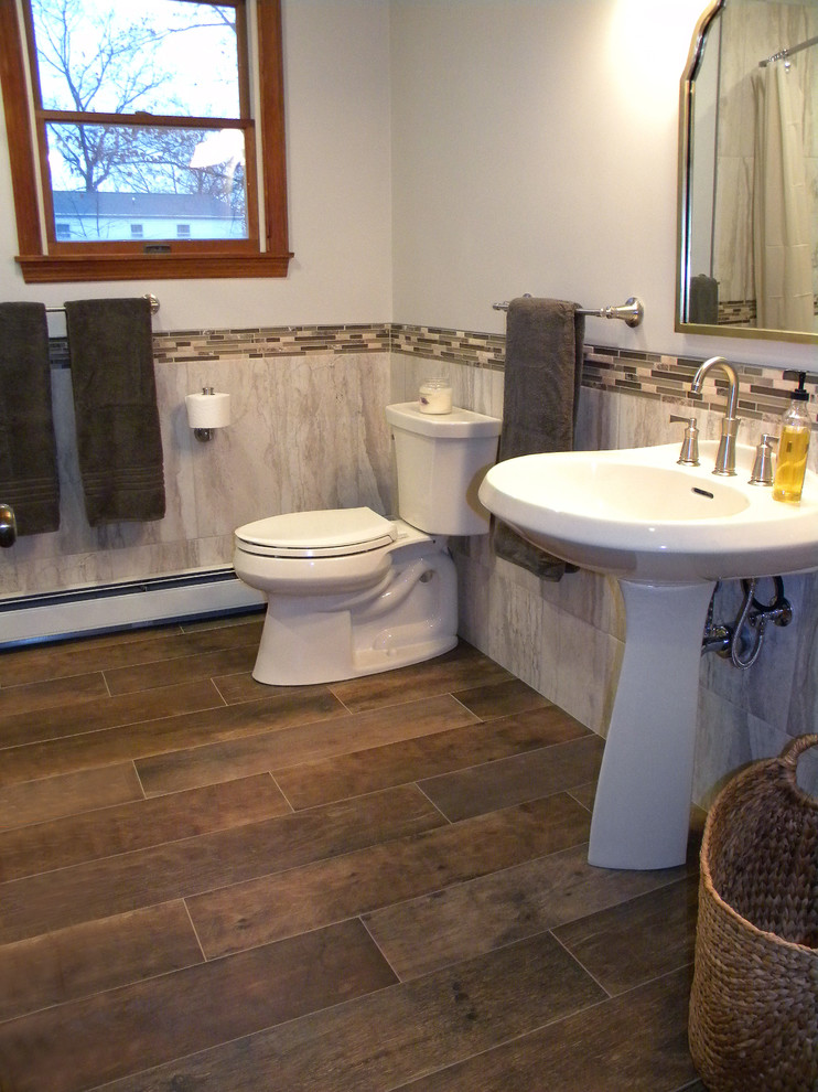 Inspiration for a mid-sized rustic brown tile and ceramic tile ceramic tile home design remodel with a one-piece toilet, gray walls and an undermount sink