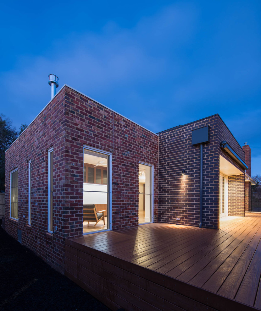 Inspiration for a large modern one-storey brick blue exterior in Melbourne with a hip roof.