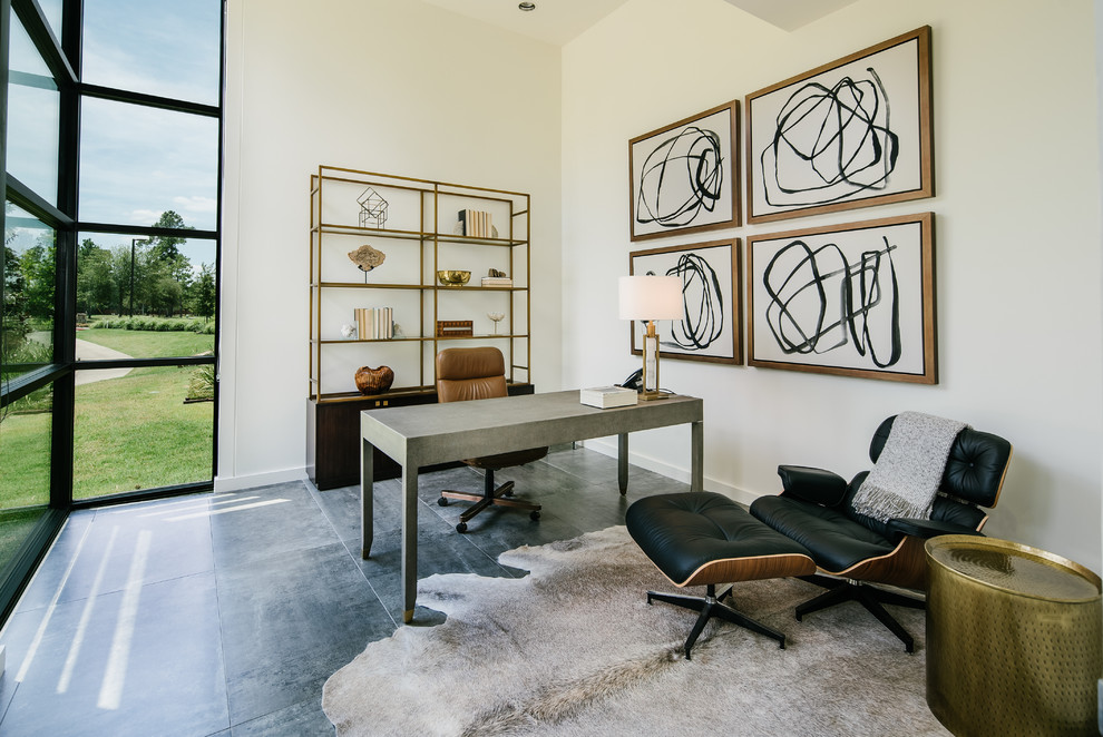 Photo of a contemporary home office in Houston with white walls, a freestanding desk and grey floor.