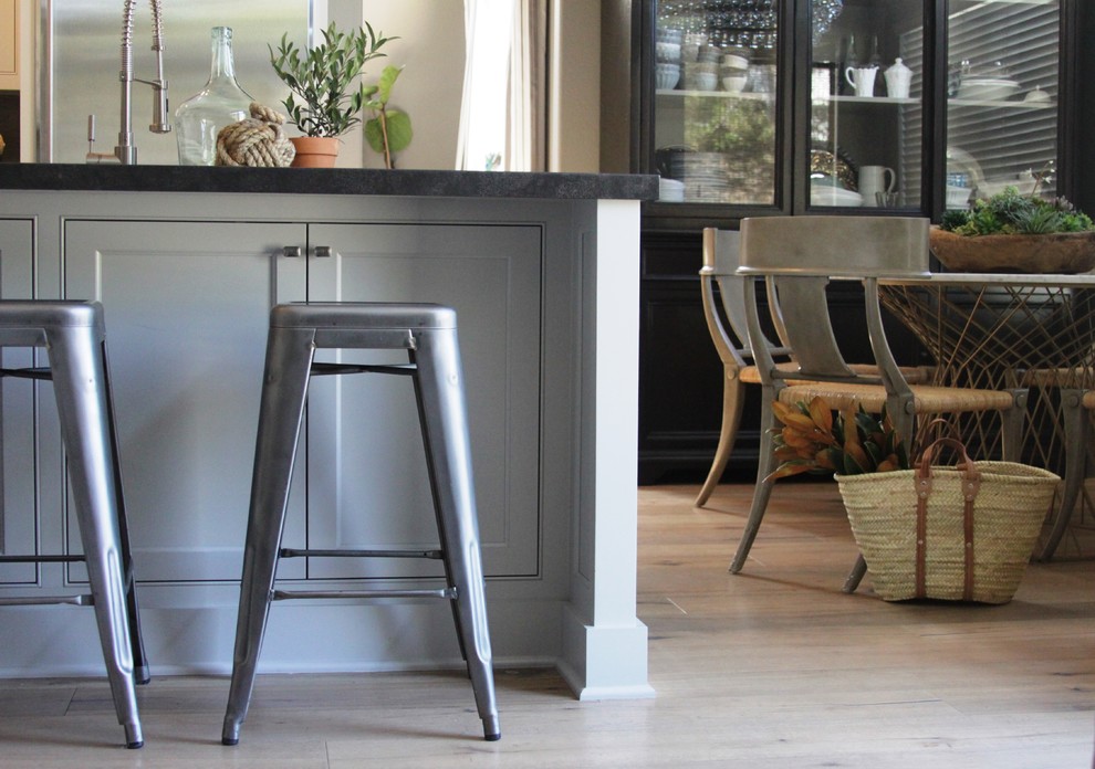 Inspiration for an eclectic l-shaped open concept kitchen remodel in Orange County with a farmhouse sink, shaker cabinets, gray cabinets and stainless steel appliances