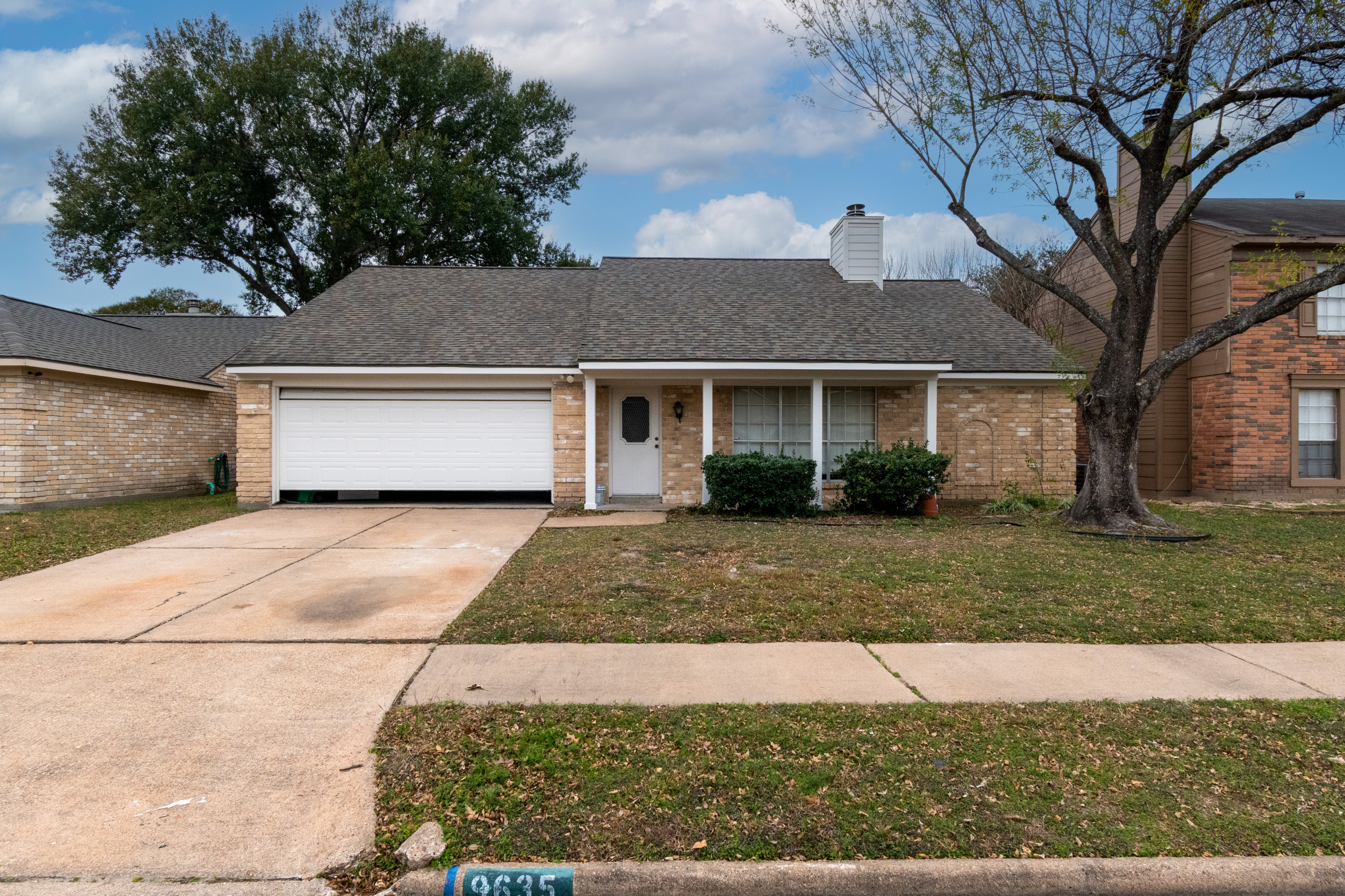Brick Home Refresh with Hardie Siding, Fascia, Soffit, and Modern Column Replace