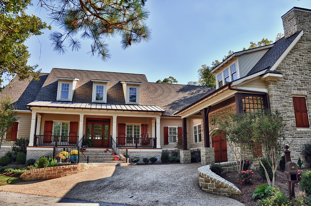 Design ideas for a traditional two-storey beige exterior in Raleigh with mixed siding.