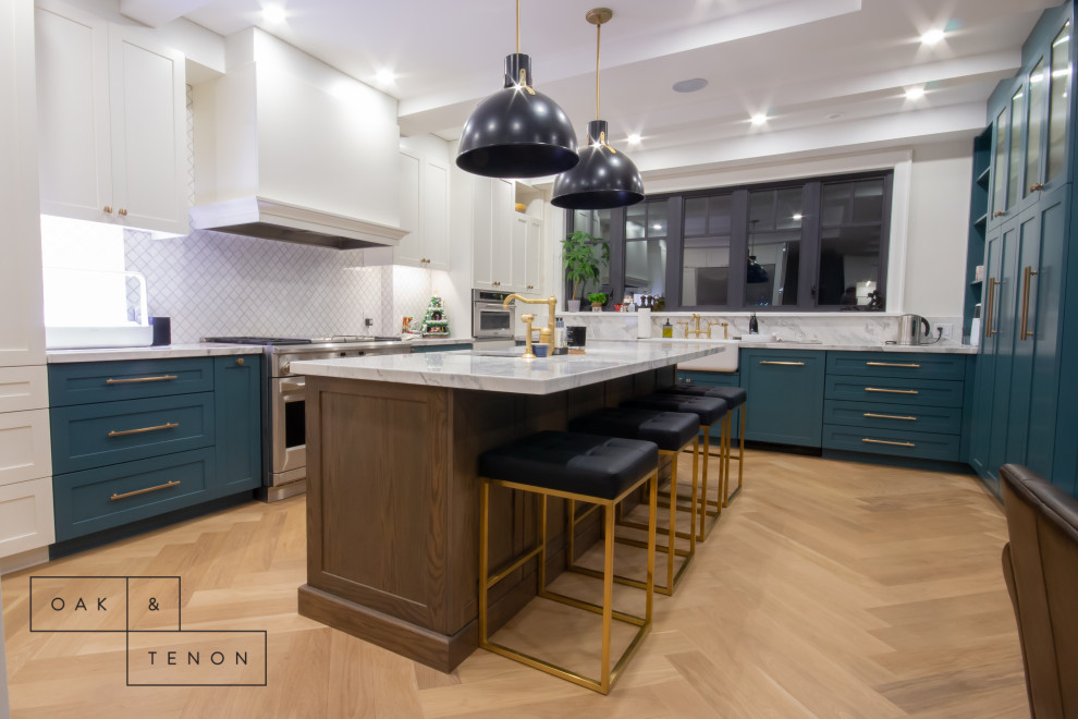Inspiration for a large transitional u-shaped eat-in kitchen remodel in Toronto with shaker cabinets and an island