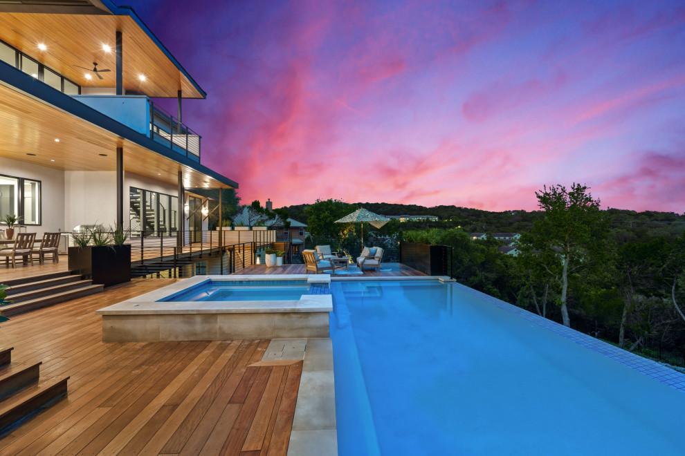 Inspiration for a mid-sized contemporary backyard pool in Austin.