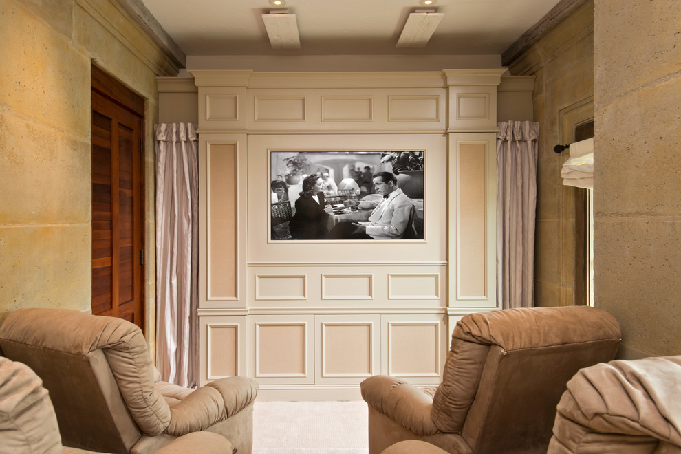 Inspiration for a mediterranean enclosed home theatre in Miami with a wall-mounted tv.
