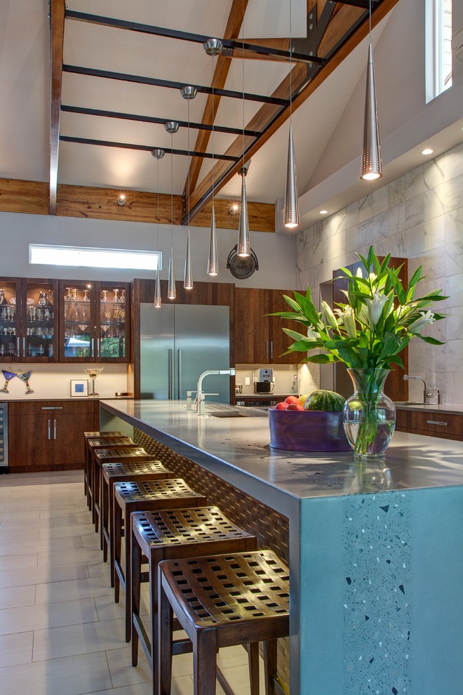 Modern kitchen in Tampa with concrete benchtops and blue benchtop.