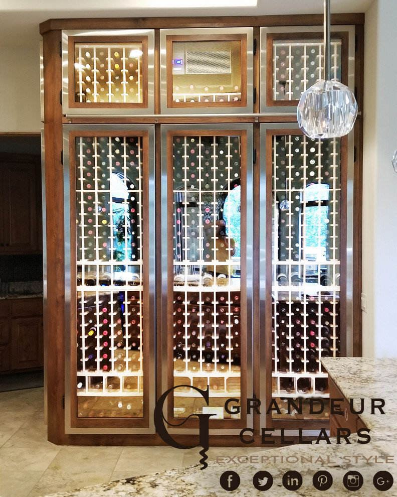This is an example of a large classic wine cellar in Austin.