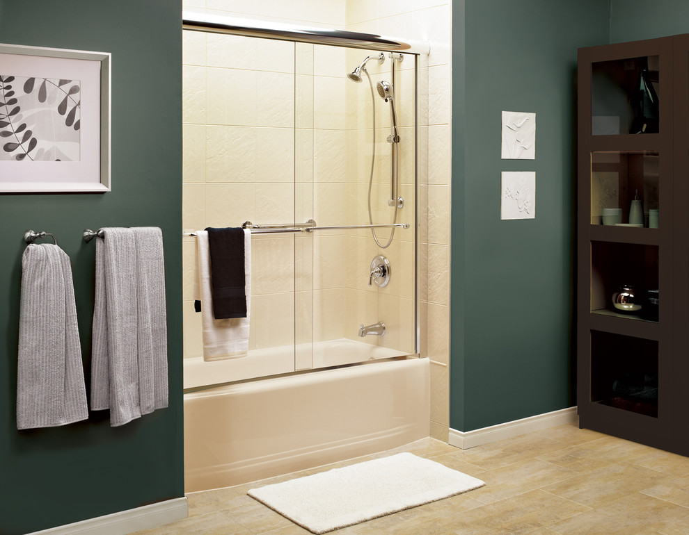 Mid-sized traditional 3/4 bathroom in Other with glass-front cabinets, dark wood cabinets, an alcove tub, a shower/bathtub combo, beige tile, porcelain tile, green walls, ceramic floors, beige floor and a sliding shower screen.