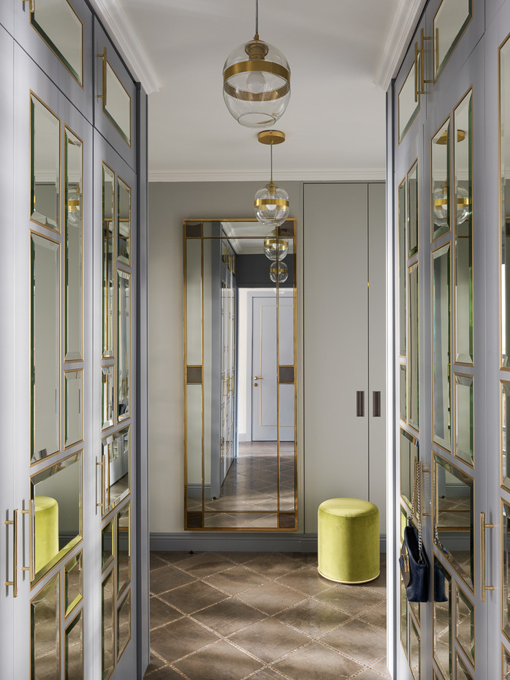 This is an example of a transitional entryway in Moscow with grey walls, marble floors and brown floor.