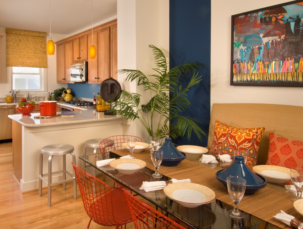 This is an example of a contemporary eat-in kitchen in DC Metro with medium wood cabinets.