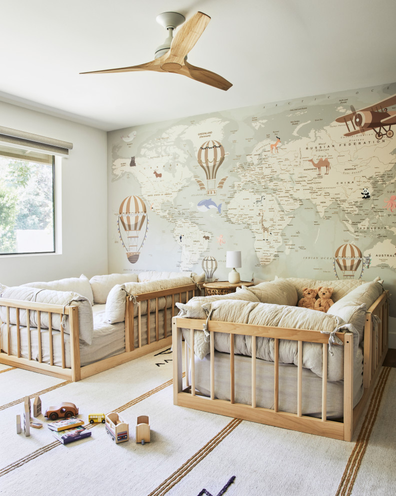 This is an example of a large classic kids' bedroom in Los Angeles with wallpapered walls and a feature wall.