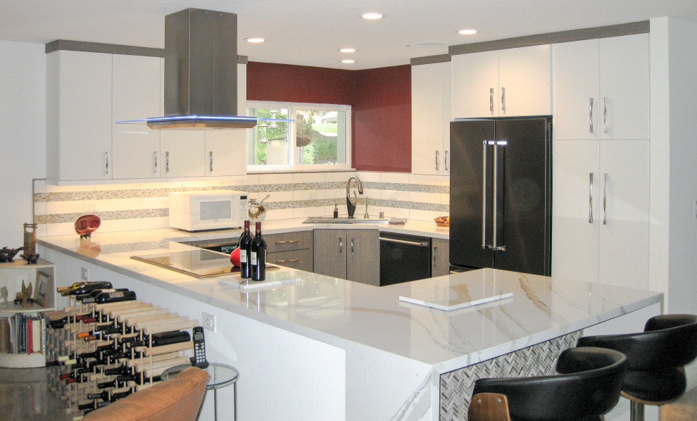 This is an example of a medium sized contemporary u-shaped open plan kitchen in San Francisco with a single-bowl sink, flat-panel cabinets, grey cabinets, engineered stone countertops, white splashback, glass tiled splashback, stainless steel appliances, vinyl flooring, a breakfast bar, grey floors and white worktops.
