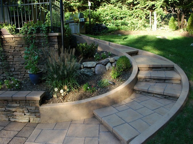 Inspiration for a large mediterranean backyard partial sun garden in New York with a garden path and concrete pavers.