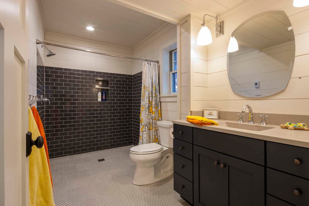 Eclectic bathroom in Other with shaker cabinets, blue cabinets, a curbless shower, a two-piece toilet, blue tile, white walls, ceramic floors, an integrated sink, concrete benchtops, white floor, a shower curtain and ceramic tile.