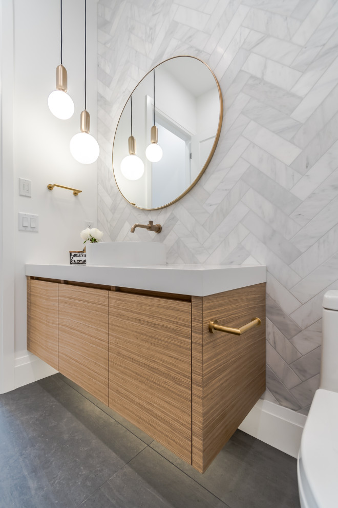 Design ideas for a large scandinavian cloakroom in Vancouver with flat-panel cabinets, light wood cabinets, a one-piece toilet, white tiles, marble tiles, white walls, porcelain flooring, a vessel sink, engineered stone worktops, grey floors, white worktops and a floating vanity unit.