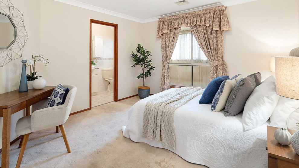 Design ideas for a large contemporary bedroom in Sydney with beige walls, carpet and beige floor.