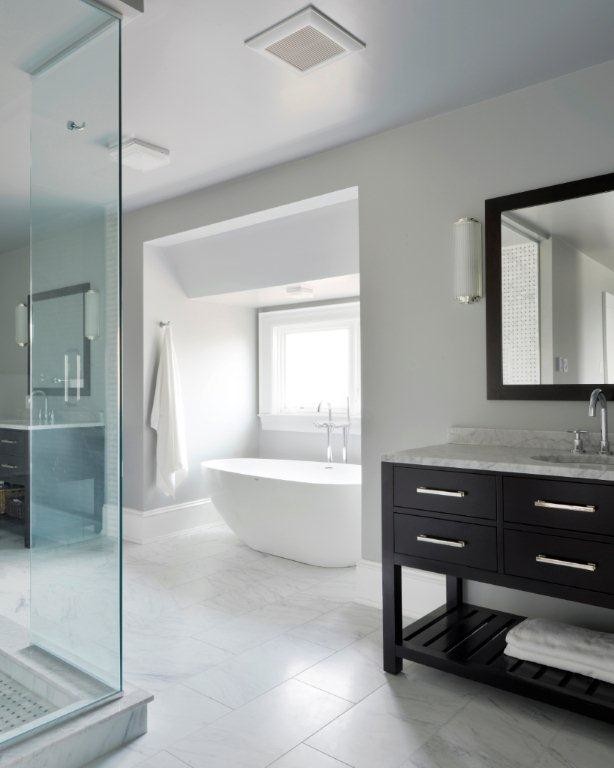 Inspiration for a large modern master bathroom in Ottawa with flat-panel cabinets, beige cabinets, a freestanding tub, an alcove shower, a one-piece toilet, white walls, marble floors, a drop-in sink and marble benchtops.