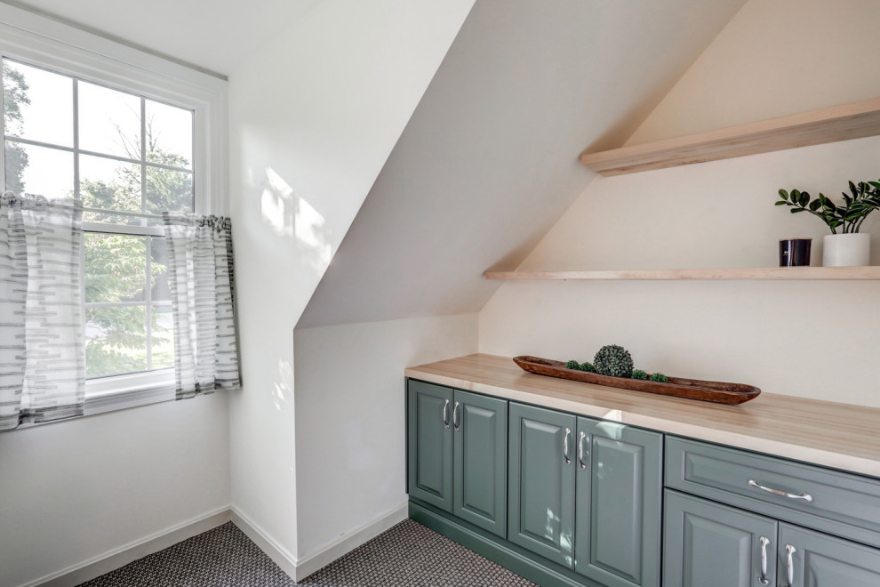 Inspiration for a mid-sized transitional freestanding desk carpeted and gray floor home office remodel with white walls