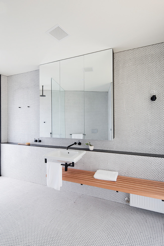 Inspiration for a large contemporary master bathroom in Geelong with open cabinets, an open shower, white tile, mosaic tile, white walls, mosaic tile floors, a wall-mount sink, tile benchtops, white floor, an open shower and black benchtops.